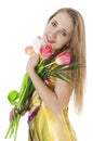 Happy smiling girl with a bouquet of spring tulips. Royalty Free Stock Photo