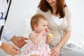 Happy smiling girl-child at usual medical inspection. Doctor and female toddler patient in the clinic. Medicine concept Royalty Free Stock Photo