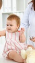 Happy smiling girl-child at usual medical inspection. Doctor and female toddler patient in the clinic. Medicine Royalty Free Stock Photo