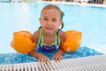 Happy smiling girl in inflatable armlets Royalty Free Stock Photo