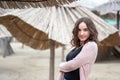 Portrait of beautiful sensitive young girl or woman posing outdoors in casual clothes with smile and adorable eyes