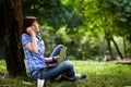 Happy smiling girl working online. Royalty Free Stock Photo