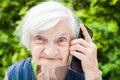 Happy smiling grandmother talking on mobile phone Royalty Free Stock Photo