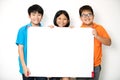 Happy smiling group of kids showing blank placard board. Royalty Free Stock Photo