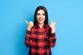 Happy smiling hipster woman showing thumbs up on blue background Royalty Free Stock Photo