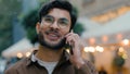 Happy smiling Indian Arabian ethnic male man tourist traveler businessman student guy having friendly talk conversation Royalty Free Stock Photo