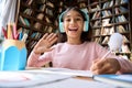 Web cam view of smiling happy indian schoolgirl on online learning classes. Royalty Free Stock Photo