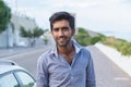 Happy smiling indian male outdoor next to his car Royalty Free Stock Photo