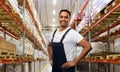 Happy smiling indian worker or loader at warehouse Royalty Free Stock Photo