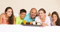 Happy smiling joyful family having breakfast in bed Royalty Free Stock Photo