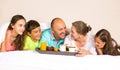 Happy smiling joyful family having breakfast in bed Royalty Free Stock Photo