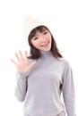 Happy, smiling, joyful woman wearing knit hat, waiving her hand to you