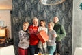 Happy smiling large family with a gift looking at the camera Royalty Free Stock Photo