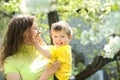 smiling little boy in the arms of his mother Royalty Free Stock Photo
