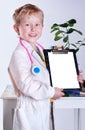 Happy smiling little boy in doctors uniform Royalty Free Stock Photo