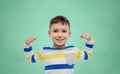 Happy smiling little boy with raised hand Royalty Free Stock Photo