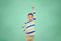 Happy smiling little boy with raised hand Royalty Free Stock Photo