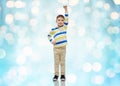 Happy smiling little boy with raised hand Royalty Free Stock Photo