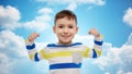 Happy smiling little boy with raised hand Royalty Free Stock Photo