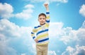 Happy smiling little boy with raised hand Royalty Free Stock Photo