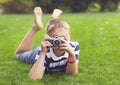 Happy smiling little boy with retro vintage camera Royalty Free Stock Photo
