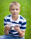 Happy smiling little boy with retro vintage camera Royalty Free Stock Photo