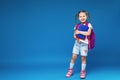 Happy smiling little girl goes to school for the first time Royalty Free Stock Photo