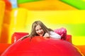 Happy Smiling Girl on Inflate Yellow Castle Royalty Free Stock Photo