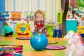 Happy smiling little girl jumping on a big rubber ball Royalty Free Stock Photo