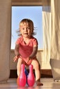 Happy smiling little girl playing bowling with colored pins Royalty Free Stock Photo