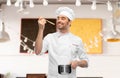 happy smiling male chef with saucepan tasting food Royalty Free Stock Photo