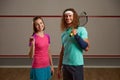 Happy smiling male and female squash player portrait