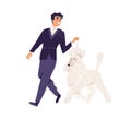 Happy smiling man in elegant formal suit walking with dog. Pet owner leading his Royal Poodle on leash. Person and