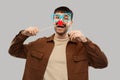 Happy smiling man with glasses and red clown nose Royalty Free Stock Photo