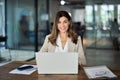 Happy mature professional business woman with laptop in office, portrait. Royalty Free Stock Photo