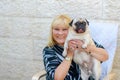 Happy smiling mature woman with pet dog outdoors. Royalty Free Stock Photo