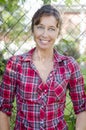 Happy smiling mature woman in red checked shirt Royalty Free Stock Photo