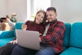 Happy smiling middle aged family couple looking at laptop screen together Royalty Free Stock Photo