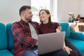 Happy smiling middle aged family couple looking at laptop screen together Royalty Free Stock Photo