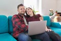 Happy smiling middle aged family couple looking at laptop screen together Royalty Free Stock Photo