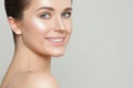 Happy smiling model with clear skin. Beautiful woman face closeup. Skincare and facial treatment concept Royalty Free Stock Photo