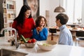 Happy multi generation family cooking together in kitchen at home Royalty Free Stock Photo