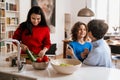 Happy multigenerational family cooking together in kitchen at home Royalty Free Stock Photo