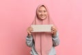 Happy smiling Muslim woman holding white board Royalty Free Stock Photo