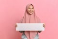 Happy smiling Muslim woman holding white board Royalty Free Stock Photo