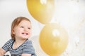 Happy and smiling one year old baby portrait with balloon background Royalty Free Stock Photo