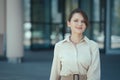 Happy smiling portrait of caucasian female company leader CEO boss executive standing in front of office building Royalty Free Stock Photo