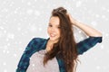 Happy smiling pretty teenage girl over snow Royalty Free Stock Photo