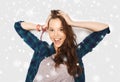 Happy smiling pretty teenage girl over snow Royalty Free Stock Photo