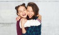 Happy smiling pretty teenage girls hugging Royalty Free Stock Photo